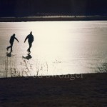 Skaters on Frozen River